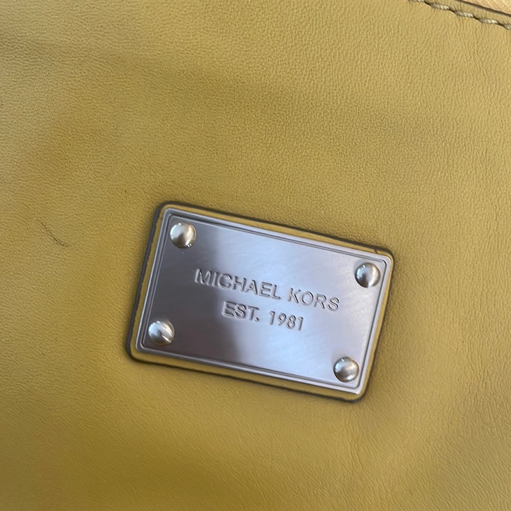Michael Kors yellow purse with fringe